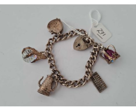 A vintage silver charm bracelet with 5 charms 40.3g inc