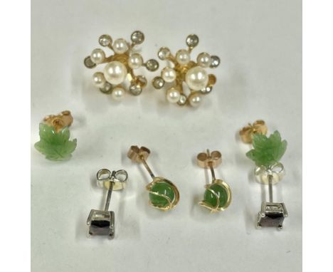 A quantity of various ear studs including a jade example