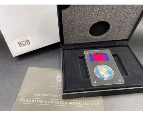 A boxed silver Waterloo medal