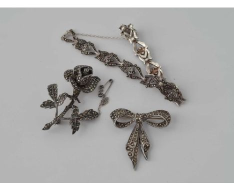 Two silver marcasite brooches and bracelet