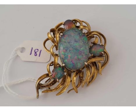 A silver gilt brooch with opal doublets