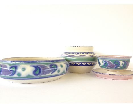 A Carter Stabler Adams red bodied fruit bowl, shape 744, decorated in the OR pattern by Margaret Holder together with a match