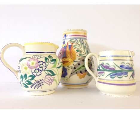 A Poole Pottery vase, decorated in the YK pattern by Hilda Hampton (6 inches) together with two jugs, decorated in the FK and