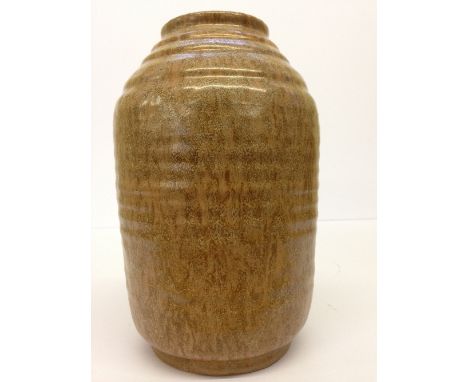 A Poole Pottery Sylvan ware ribbed vase decorated in a mottled brown (M38) glaze (7.5 inches).