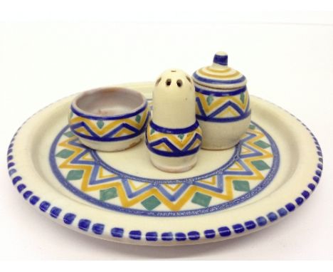 A Carter Stabler Adams red bodied Poole Pottery plate decorated in the LD pattern together with a matching miniature three pi