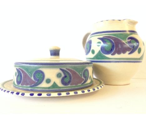 A Poole Pottery crumpet dish, decorated in the OR pattern (badly crazed) together with a red bodied Carter Stabler Adams OR p