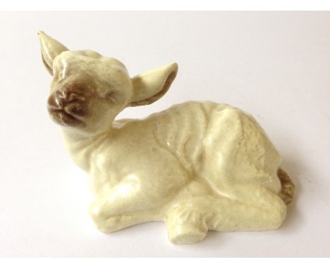 A Poole Pottery model of a lamb designed and modelled by Marjorie Drawbell circa 1948, shape 828.
