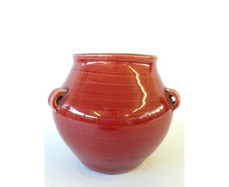 An early Carters Poole Pottery red lustre glazed three lug handled hanging vase in the style of Liberty (4 inches).