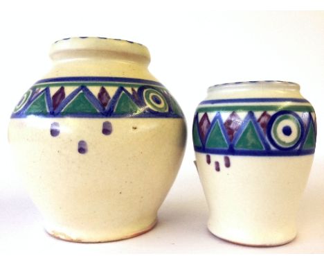 A Carter Stabler Adams red bodied Poole Pottery squat vase, shape 333, decorated in the KZ pattern together with a smaller ma