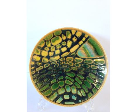 A Poole Pottery Delphis Studio dish, decorated in an abstract pattern in tones of green and yellow.