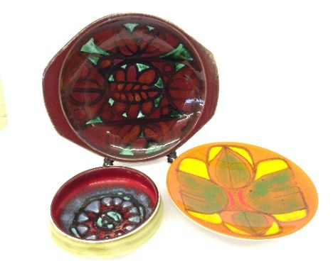A Poole Pottery Delphis dish, shape 4, decorated in an abstract pattern on orange ground by Lynn Gregory together with a twin