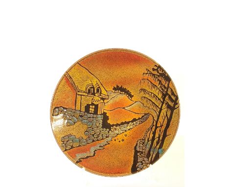 A Poole Pottery Aegean dish decorated in a cottage and landscape scene.