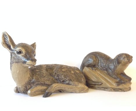 A Poole Pottery Barbara Linley Adams stoneware model of a Large Fawn together with an Otter.
