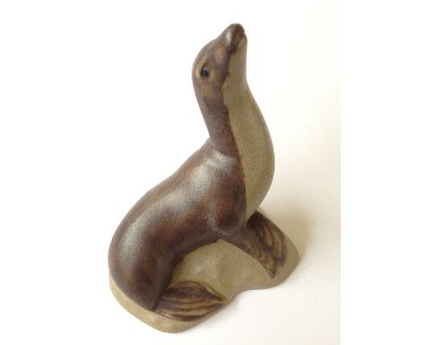 A Poole Pottery brown stoneware model of a seal (4.25 inches).