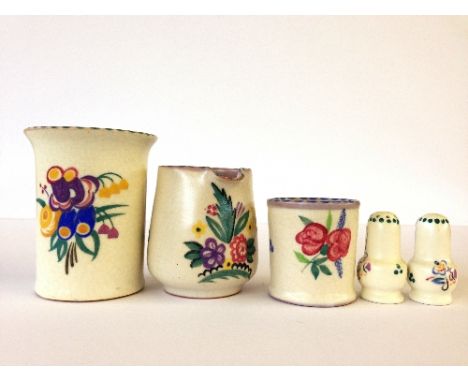 Three various red bodied Poole Pottery items together with a pair of miniature salt pots.