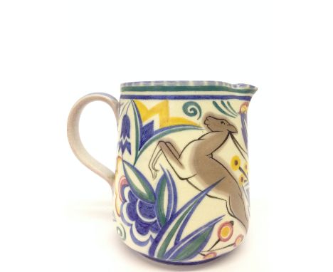 A Poole Pottery jug decorated in the TZ Leaping Deer pattern by Phyllis Ryall (5 inches).