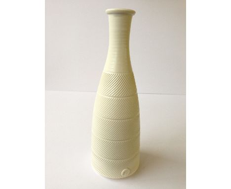 A modern Poole Studio Limited Edition carved bottle shaped vase by Alan White.