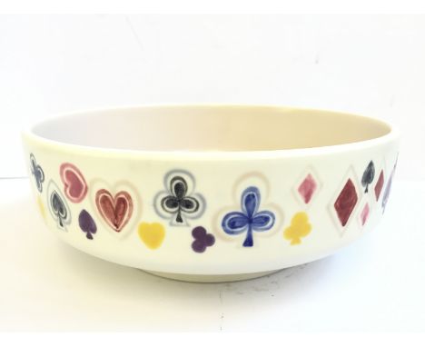 A Poole Pottery fruit bowl decorated with playing card suits made for John Waddington.