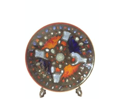 A Poole Pottery Delphis dish, shape 4, decorated in an abstract pattern with tones of blue and red.