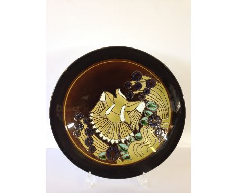 A Poole Pottery Ionian carved dish, shape 54, decorated with a Flying Dove and Fruit, decorated by Ros Sommerfelt.