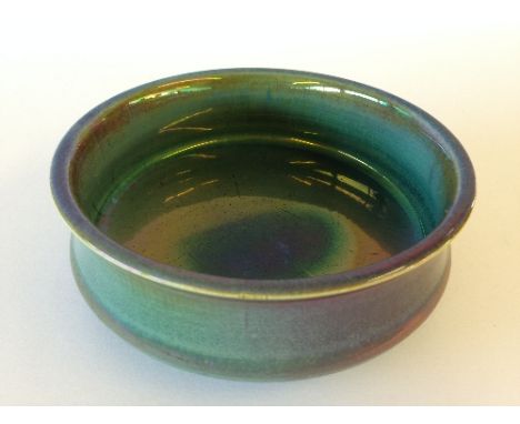 An early Carters Poole Pottery blue lustre glaze bowl, dated 1903 to base (5 inches diameter).