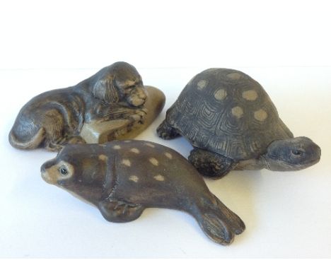A Poole Pottery Barbara Linley Adams stoneware model of a Puppy on a Slipper together with a Tortoise and Seal.