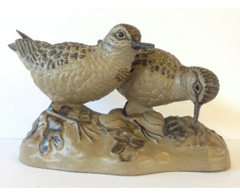 A Poole Pottery Barbara Linley Adams stoneware model of a Pair of Sandpipers, numbered 460 (beak to one bird restored).