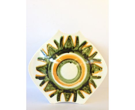 A Poole Pottery "Packet of Crisps" shaped vase, decorated in an abstract pattern on white ground in tones of green and orange