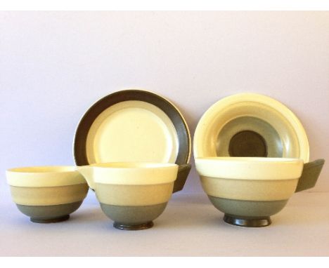 A Poole Pottery Everest tea for one Art Deco teaset, circa 1920's designed by John Adams comprising cup, saucer, milk jug, su