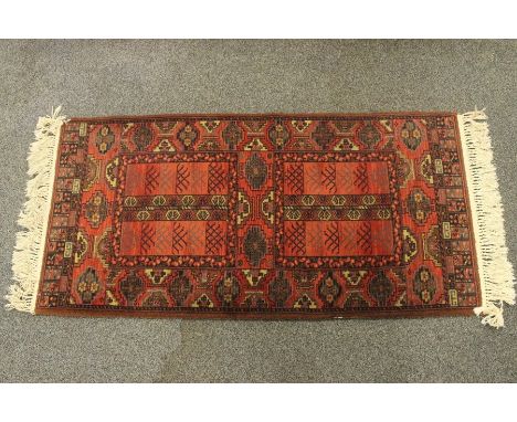 Three woollen rugs, the first Moussol example approx 67 x 134 cms, terracotta and olive green colour way, geometric design wi
