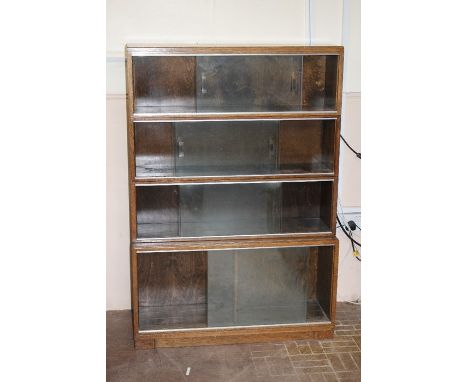 Vintage Minty mahogany stacking bookcase, glaze fronted, approx 89 w x 129 h x 23 cms at its shallowest point and 29 cms at i