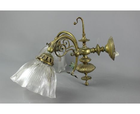 Victorian Brass Wall Light; the twin-branch light having a fluted glass shade, approx 64 cms w.&nbsp;