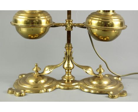 Antique brass telescopic double shade oil lamp, converted to electricity, with amber milk glass shades, approx 64 cms h.
