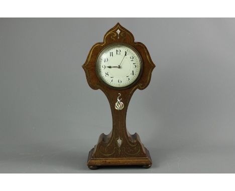 An Art Nouveau mantel clock; the clock decorated with mother-of-pearl inlay, baton numerals, approx 32 cms h&nbsp;