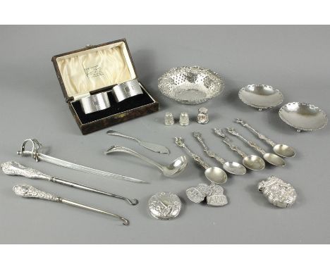 Miscellaneous silver, including a silver letter opener modelled as a sabre, Sheffield hallmark, dated 1895, pair of silver na