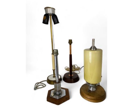 A group of vintage table lamps
Comprising of two 1930's lamps and two mid-century lamps, one German with twin lights and a pu
