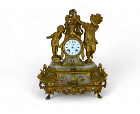 A late 19th century French gilt spelter and onyx figural mantel clock by Lecler, Jeune
In the form of two young girls with a 