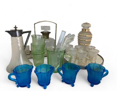 An Art Deco glass cocktail set on stand, a liquor tantalus and a quantity of pressed and other glassware
The cocktail set com