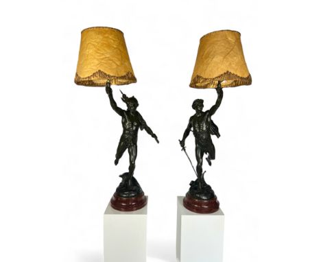 After Emile Picault (French, 1833-1915), A large and impressive pair of patinated spelter classical male figural lamps One ti