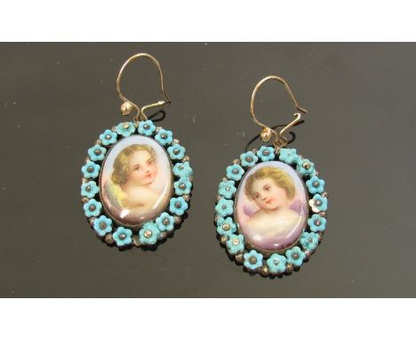 A pair of Georgian earrings of oval form, the central handpainted image of cherubs on mother-of-pearl, framed by delicate ste