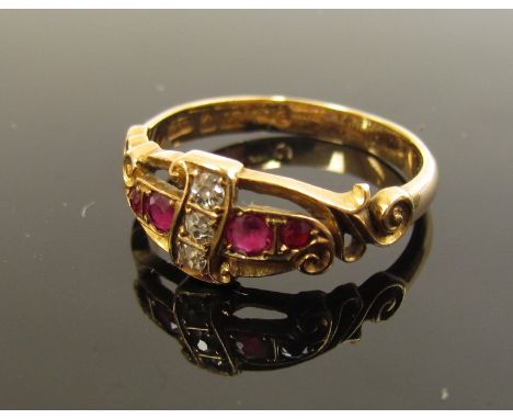 An 18ct gold diamond and ruby ring, marks rubbed. Size P, 3.3g