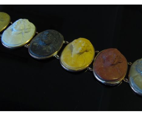 A Victorian seven panel lava cameo bracelet each panel depicting different profile of different colours, 18.5cm long 
