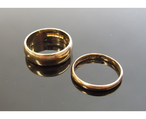 A 9ct gold band, 5mm wide. Size M, 4.2g and a 9ct gold band, 2mm wide. Size K, 1.4g