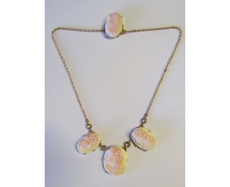 A Victorian gold panel necklace, the three ovals carved in high relief depicting female heads and matching clasp      