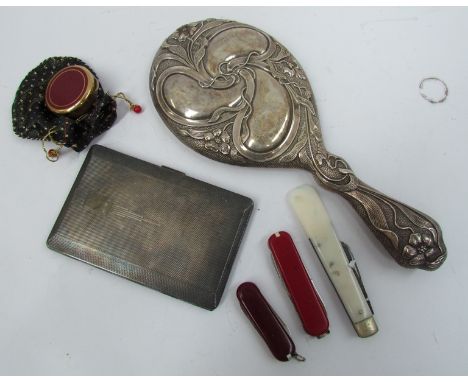 A silver Art Nouveau hand mirror, Birmingham 1904, a plated cigarette case, three penknives and a patch pot