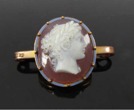 A gold framed cameo bar brooch the cameo of female framed by blue enamel border, unmarked, 7.6g (cameo 22mm x 20mm)