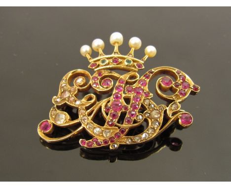 A gold diamond, ruby, seed pearl and emerald coronet monogrammed brooch, unmarked, 2.8cm x 4cm, 8.9g