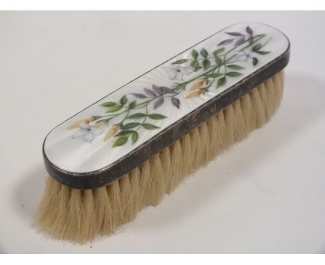 A HALLMARKED SILVER AND ENAMEL CLOTHES BRUSH