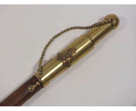 AN UNUSUAL CANADIAN BRASS TOP SWAGGER STICK WITH HIDDEN LIGHTER