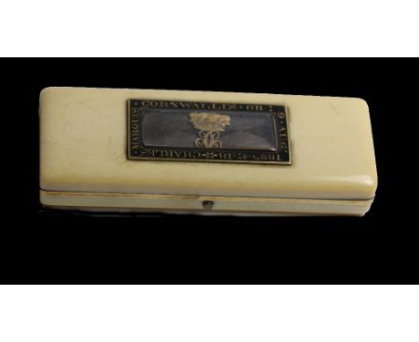 A George IV gold mounted ivory memorial tooth pick box, the hinged cover with an interior mirror and mounted with a glazed lo